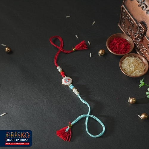 Red & Blue Evil Eye Handmade Rakhi – Stylish Protection for Brother