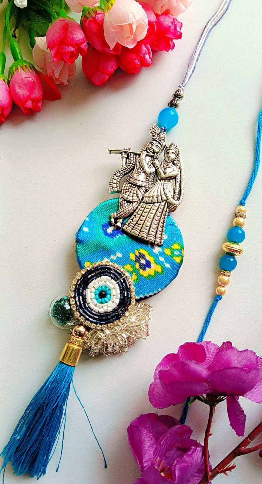 Handmade Radha Krishna Rakhi – Blue Thread with Ethnic Motif, Beaded Evil Eye & Silk Tassel