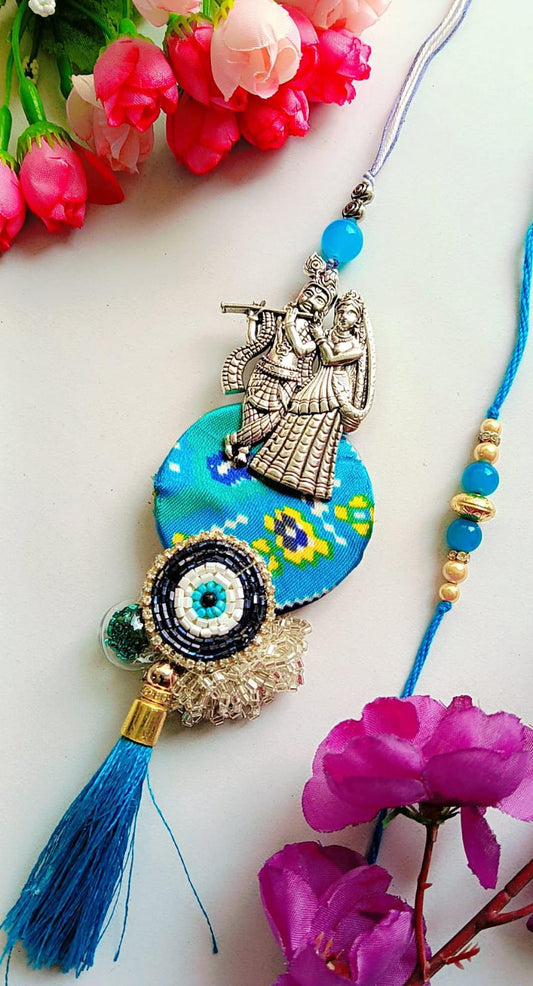 Handmade Radha Krishna Rakhi – Blue Thread with Ethnic Motif, Beaded Evil Eye & Silk Tassel
