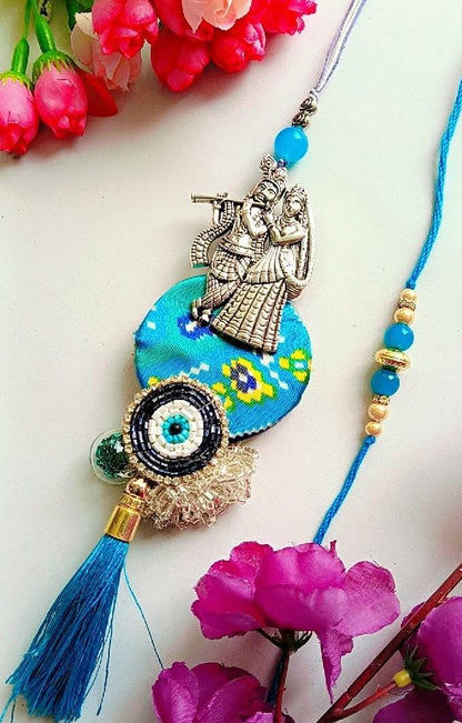 Handmade Radha Krishna Rakhi – Blue Thread with Ethnic Motif, Beaded Evil Eye & Silk Tassel