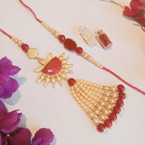 Handmade Bhaiya Bhabhi Rakhi Set – Red & Gold Pearl Tassel Design with Royal Motif