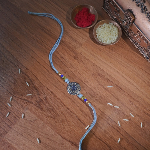 Handmade Rakhi – Blue Thread with Antique Beaded Centerpiece for Brother