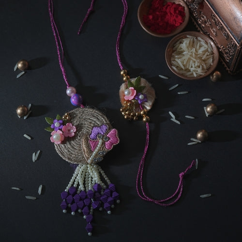 Handmade Bhaiya Bhabhi Rakhi Pair – Rustic Jute Floral Design with Pearls & Purple Tassels