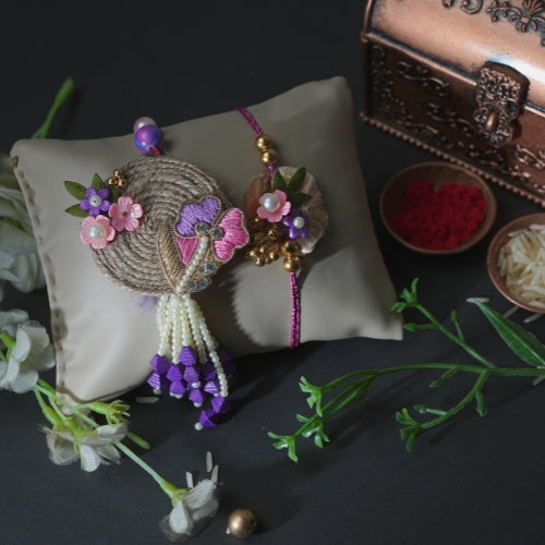Handmade Bhaiya Bhabhi Rakhi Pair – Rustic Jute Floral Design with Pearls & Purple Tassels
