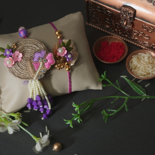 Handmade Bhaiya Bhabhi Rakhi Pair – Rustic Jute Floral Design with Pearls & Purple Tassels