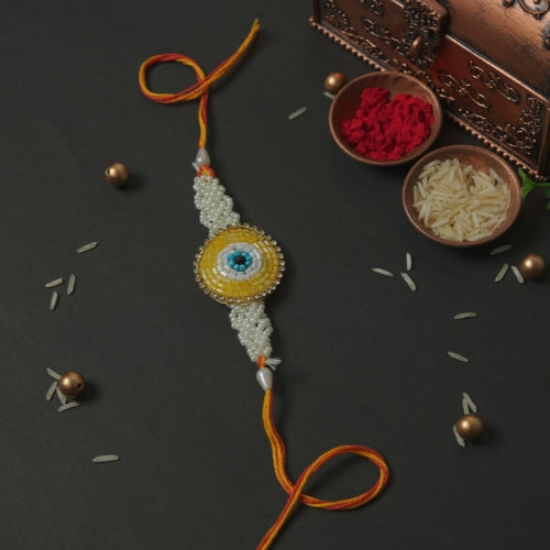 Handmade Rakhi – Yellow Beaded Rakhi with Pearls on Orange Thread