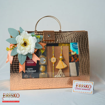Premium Copper Bag Rakhi Gift Hamper – Luxury Celebration Set with Pair of Rakhi & Gourmet Treats