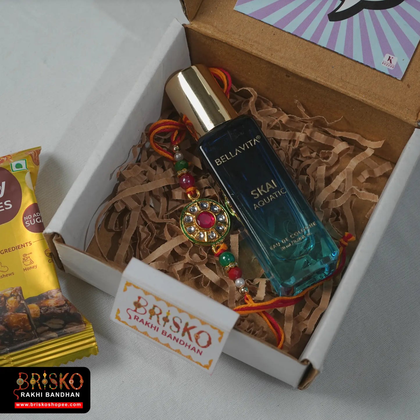 Box Rakhi Hamper – Bellavita Perfume & Healthy Treat with Rakhi for Brother
