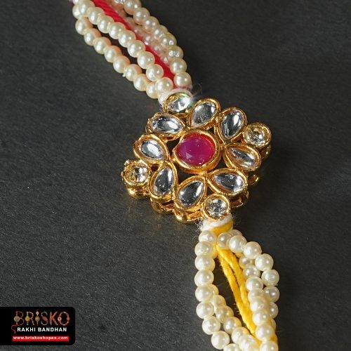 Elegant Pearl Flower Rakhi with Tricolor Thread – Graceful Handmade Rakhi for Brother