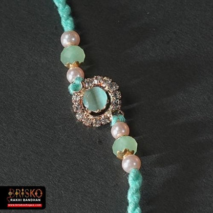 Kundan Pearl Rakhi – Elegant Multicolor Design for a Royal Bond