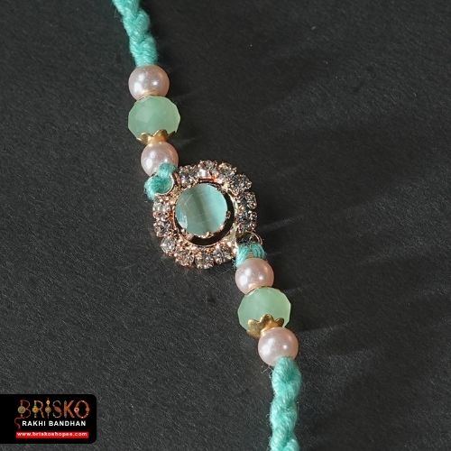 Kundan Pearl Rakhi – Elegant Multicolor Design for a Royal Bond
