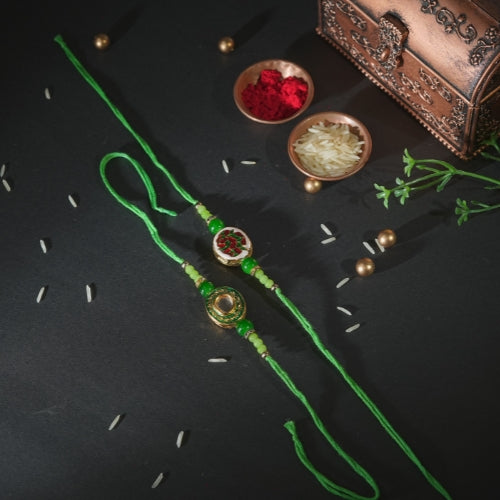 Handmade Bhaiya Bhabhi Rakhi Pair – Green Thread with Kundan & Floral Resin Charm