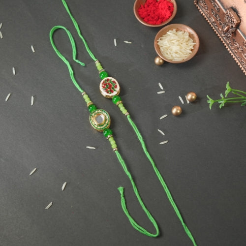 Handmade Bhaiya Bhabhi Rakhi Pair – Green Thread with Kundan & Floral Resin Charm
