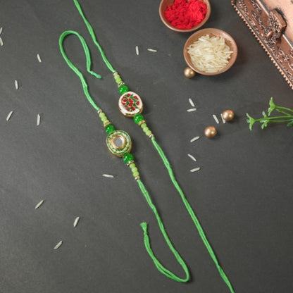 Handmade Bhaiya Bhabhi Rakhi Pair – Green Thread with Kundan & Floral Resin Charm