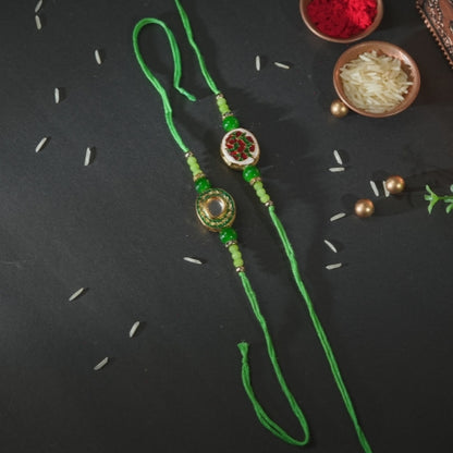 Handmade Bhaiya Bhabhi Rakhi Pair – Green Thread with Kundan & Floral Resin Charm