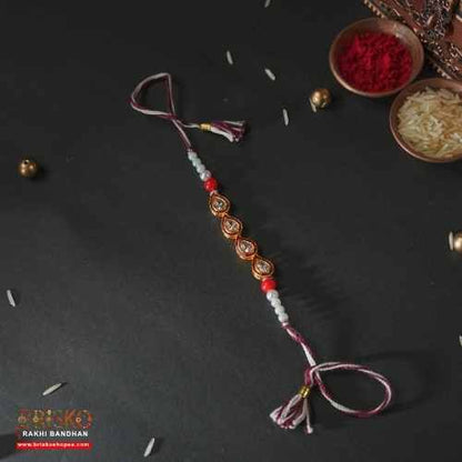 Elegant Teardrop Beaded Rakhi – Grace Woven in Every Thread