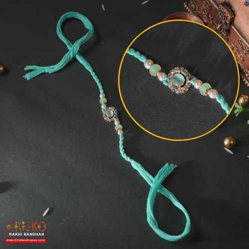 Kundan Pearl Rakhi – Elegant Multicolor Design for a Royal Bond