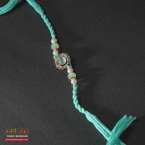 Kundan Pearl Rakhi – Elegant Multicolor Design for a Royal Bond