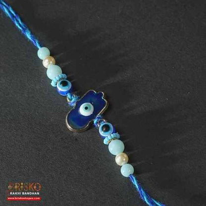 Hamsa Evil Eye Rakhi with Blue Thread – Handmade Nazar Raksha Rakhi for Brother
