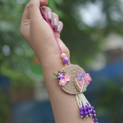 Handmade Bhaiya Bhabhi Rakhi Pair – Rustic Jute Floral Design with Pearls & Purple Tassels
