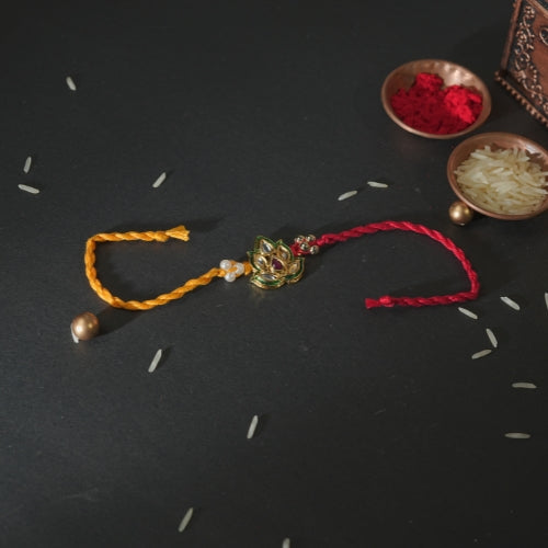 Handmade Rakhi – Red and Yellow Dual Thread Rakhi with Kundan Leaf Design