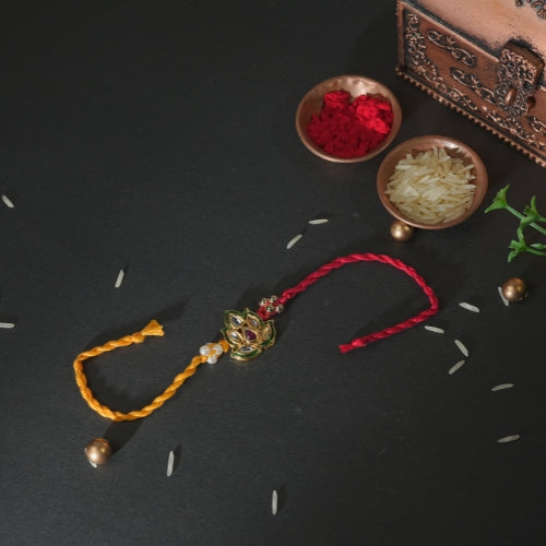Handmade Rakhi – Red and Yellow Dual Thread Rakhi with Kundan Leaf Design