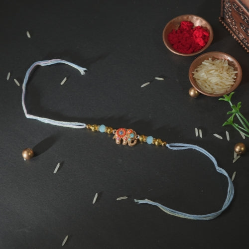 Handmade Rakhi – Blue Thread Rakhi with Enamel Elephant Charm & Golden Beads