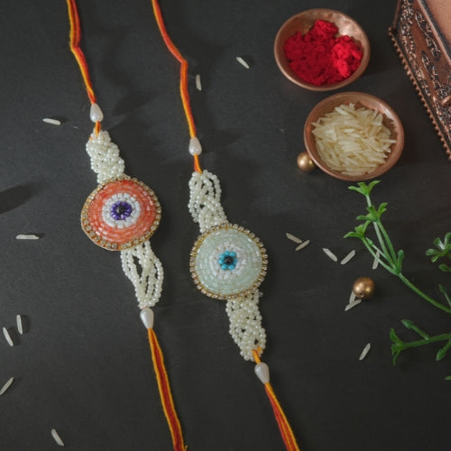 Handmade Rakhi Set – Twin Beaded Rakhis with Orange Thread & Pearl Work