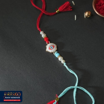 Red & Blue Evil Eye Handmade Rakhi – Stylish Protection for Brother